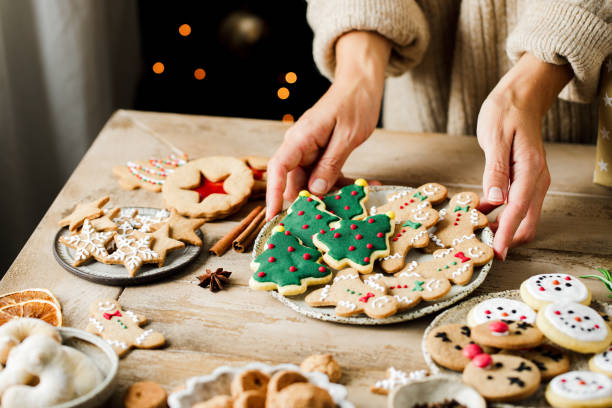 woman hands arranging sweets on table